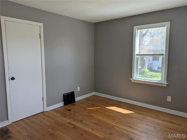 330 N Floridale Ave, Saint Louis, MO 63135 - spare room with wood finished floors and baseboards