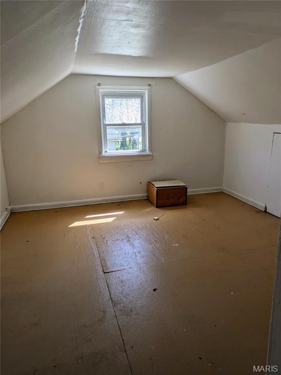 330 N Floridale Ave, Saint Louis, MO 63135 - additional living space featuring vaulted ceiling and baseboards