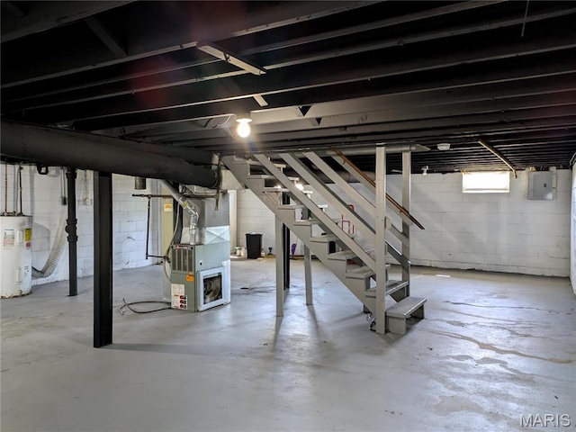 330 N Floridale Ave, Saint Louis, MO 63135 - below grade area with water heater, electric panel, stairway, and heating unit