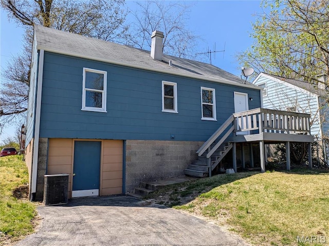 330 N Floridale Ave, Saint Louis, MO 63135 - rear view of property featuring central AC, a chimney, a yard, stairway, and a deck