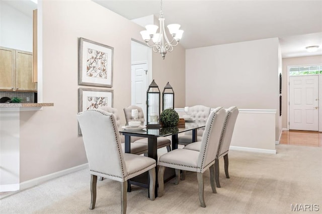 104 Eagle Cove Pl Unit 39B, Saint Charles, MO 63303 - dining room featuring a chandelier, baseboards, and light colored carpet