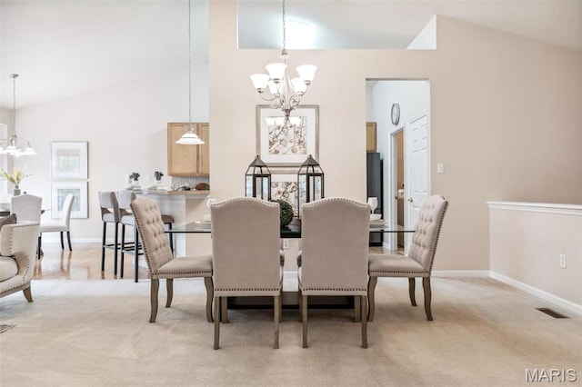 104 Eagle Cove Pl Unit 39B, Saint Charles, MO 63303 - dining area with a chandelier, light carpet, baseboards, and high vaulted ceiling