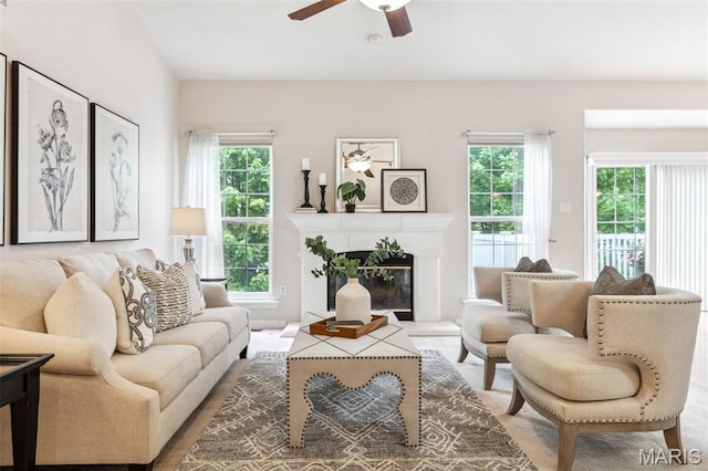 104 Eagle Cove Pl Unit 39B, Saint Charles, MO 63303 - living room with healthy amount of natural light, a ceiling fan, and a glass covered fireplace