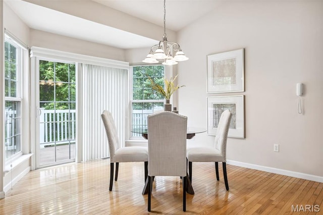 104 Eagle Cove Pl Unit 39B, Saint Charles, MO 63303 - dining area with a chandelier, plenty of natural light, and light wood-style flooring