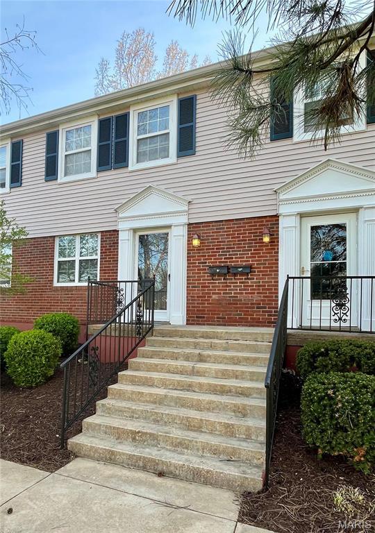 1504 Swallow Dr, Saint Louis, MO 63144 - view of front of home featuring brick siding