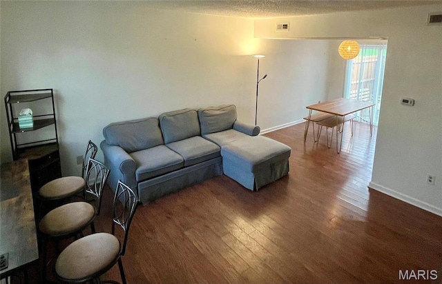 1504 Swallow Dr, Saint Louis, MO 63144 - living area featuring wood finished floors and baseboards