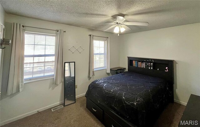 1504 Swallow Dr, Saint Louis, MO 63144 - carpeted bedroom featuring a textured ceiling, baseboards, and a ceiling fan