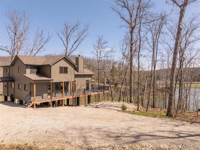 370 Alpine Bend Dr, Wright City, MO 63390 - back of property with a chimney, a deck, and a shingled roof