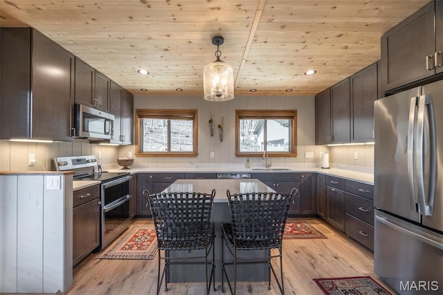 370 Alpine Bend Dr, Wright City, MO 63390 - kitchen featuring stainless steel appliances, wooden ceiling, a sink, light wood-type flooring, and dark brown cabinets