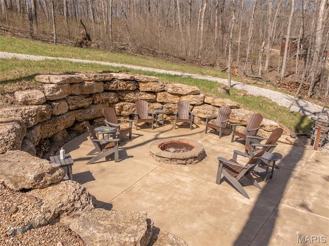 370 Alpine Bend Dr, Wright City, MO 63390 - view of patio with an outdoor fire pit and a view of trees