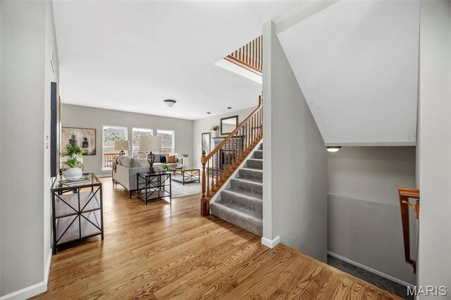 407 Forby Estates Dr, Eureka, MO 63025 - staircase with wood finished floors and baseboards