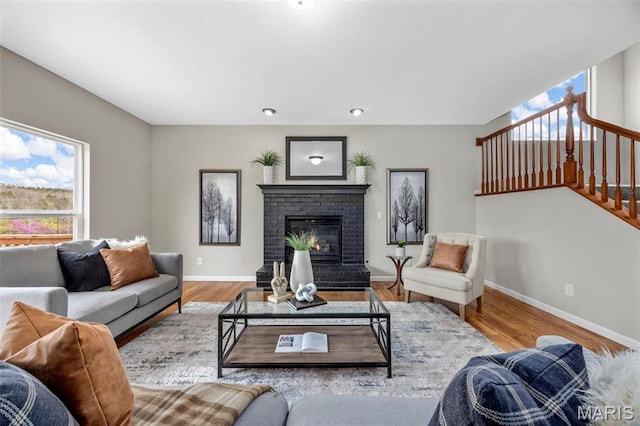 407 Forby Estates Dr, Eureka, MO 63025 - living area featuring plenty of natural light, baseboards, a fireplace, stairs, and recessed lighting