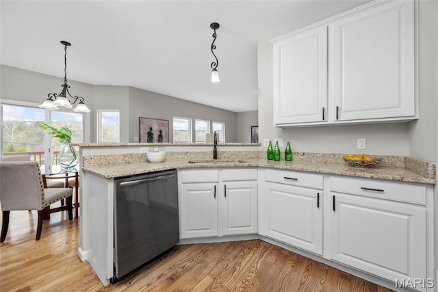 407 Forby Estates Dr, Eureka, MO 63025 - kitchen featuring stainless steel dishwasher, a sink, light wood finished floors, white cabinetry, and pendant lighting