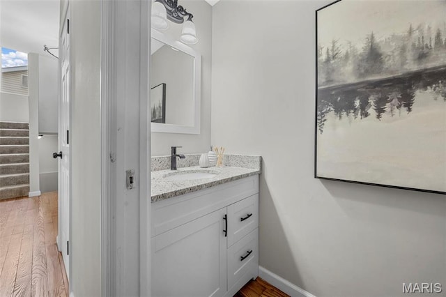 407 Forby Estates Dr, Eureka, MO 63025 - bathroom with wood finished floors, baseboards, and vanity