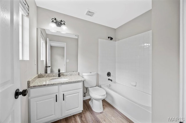 407 Forby Estates Dr, Eureka, MO 63025 - bathroom featuring wood finished floors, vanity, toilet, shower / washtub combination, and baseboards