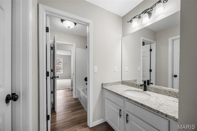 407 Forby Estates Dr, Eureka, MO 63025 - bathroom featuring vanity, wood finished floors, baseboards, and shower / washtub combination