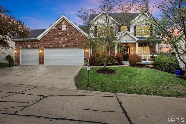 407 Forby Estates Dr, Eureka, MO 63025 - traditional home featuring driveway, brick siding, an attached garage, covered porch, and a front yard