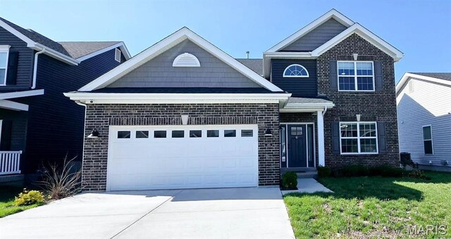145 Pampano Ln, Saint Charles, MO 63301 - view of front of house featuring brick siding, a garage, and driveway