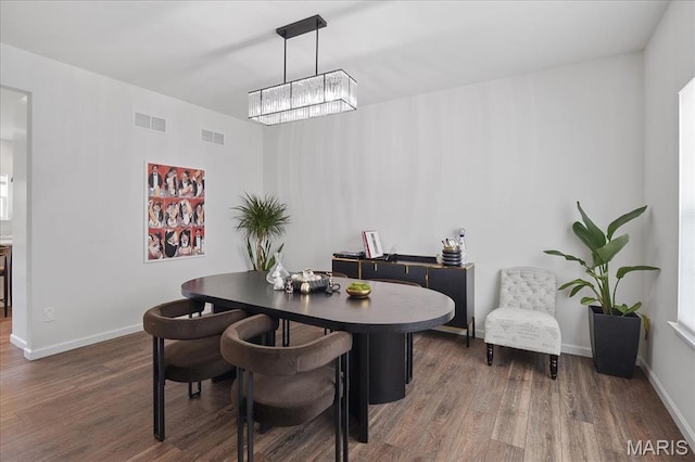 145 Pampano Ln, Saint Charles, MO 63301 - dining area featuring wood finished floors, a chandelier, and baseboards