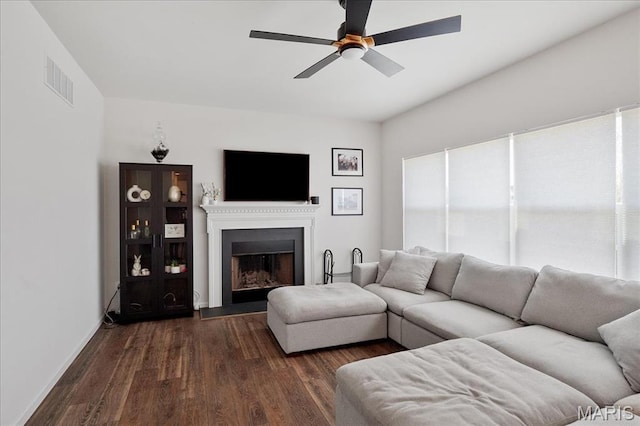 145 Pampano Ln, Saint Charles, MO 63301 - living room with a ceiling fan, dark wood finished floors, a fireplace with raised hearth, and baseboards