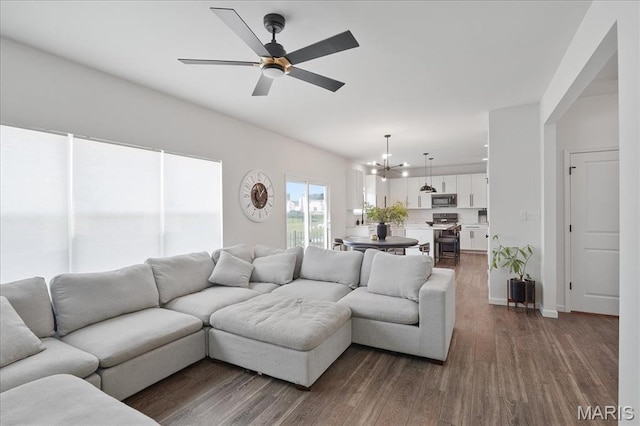145 Pampano Ln, Saint Charles, MO 63301 - living room with a chandelier, dark wood finished floors, and a ceiling fan
