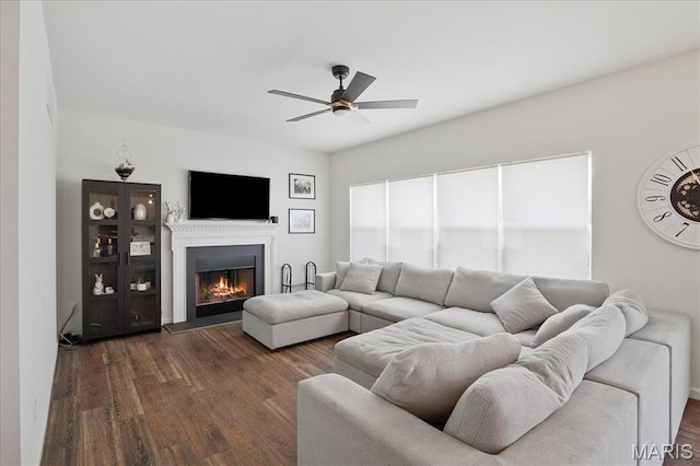 145 Pampano Ln, Saint Charles, MO 63301 - living room with a ceiling fan, dark wood-style floors, and a lit fireplace