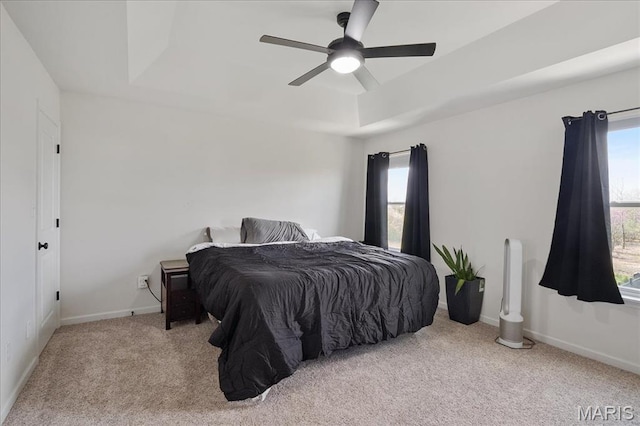 145 Pampano Ln, Saint Charles, MO 63301 - bedroom with a tray ceiling, carpet, baseboards, and a ceiling fan