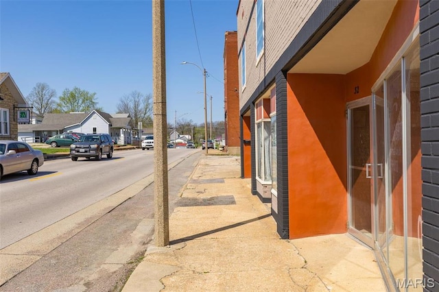 32 W School St, Bonne Terre, MO 63628 - view of asphalt road with sidewalks, street lighting, a residential view, and curbs