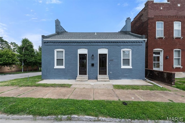 6800 Minnesota Ave, Saint Louis, MO 63111 - multi unit property with entry steps, a chimney, brick siding, and roof with shingles