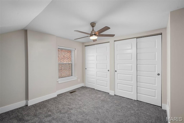 6800 Minnesota Ave, Saint Louis, MO 63111 - unfurnished bedroom with two closets, carpet flooring, baseboards, and ceiling fan