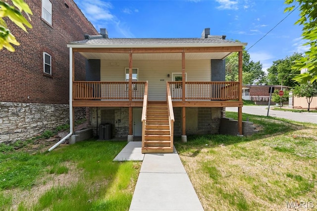 6800 Minnesota Ave, Saint Louis, MO 63111 - back of property with stairs, a chimney, a wooden deck, and central AC unit