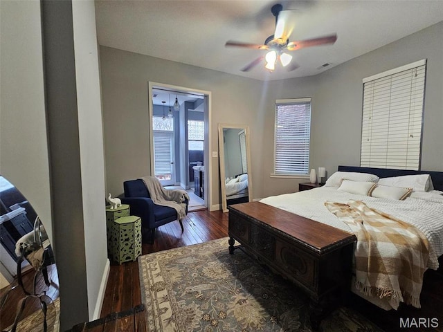 bedroom with hardwood / wood-style floors, baseboards, and a ceiling fan