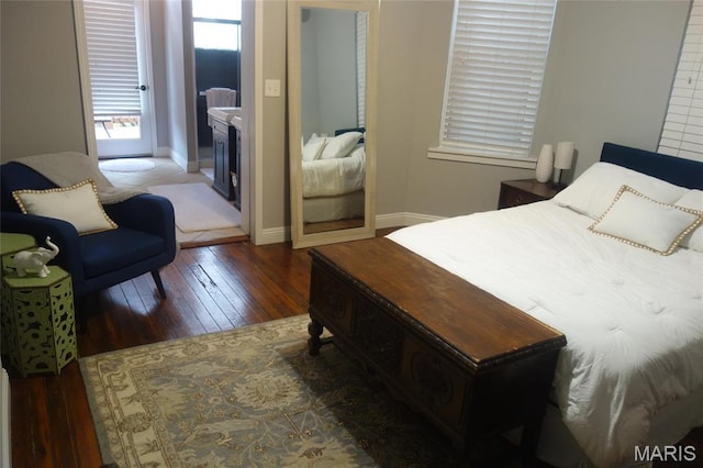 bedroom featuring hardwood / wood-style flooring and baseboards