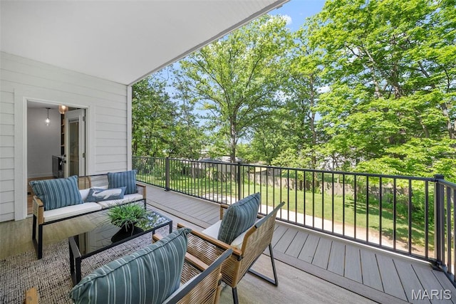 wooden deck with outdoor lounge area