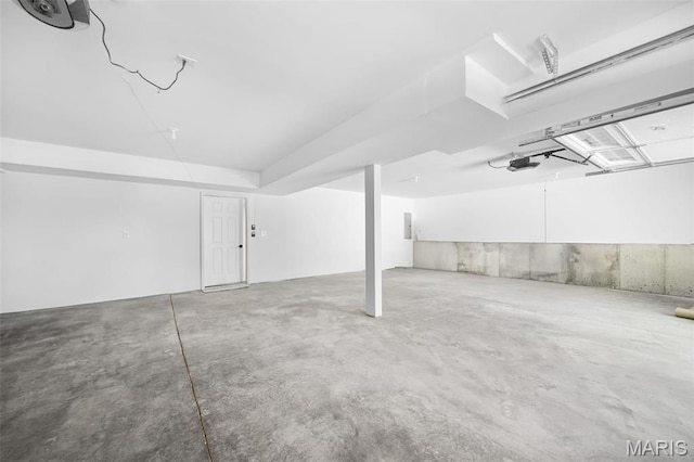 below grade area with a garage and electric panel