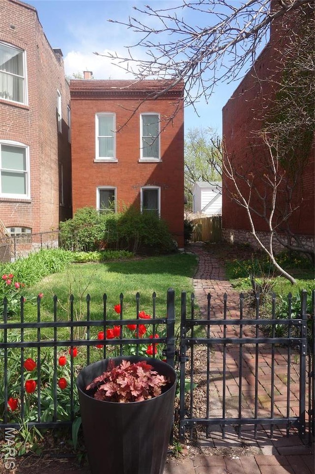 view of yard with fence and a gate