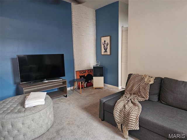 living room with carpet and baseboards