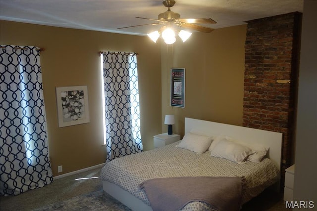 bedroom with carpet, baseboards, and a ceiling fan