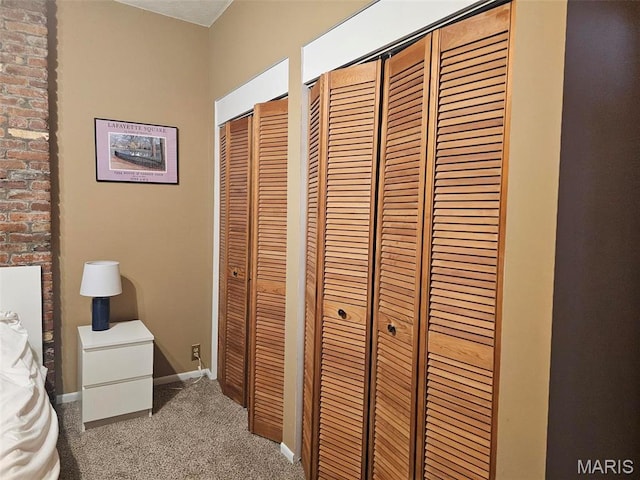 carpeted bedroom with baseboards