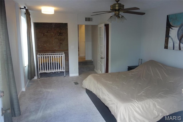 bedroom with carpet floors and baseboards