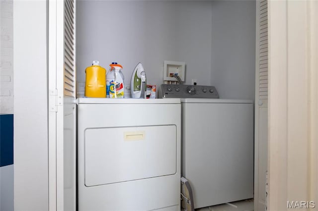 washroom featuring independent washer and dryer