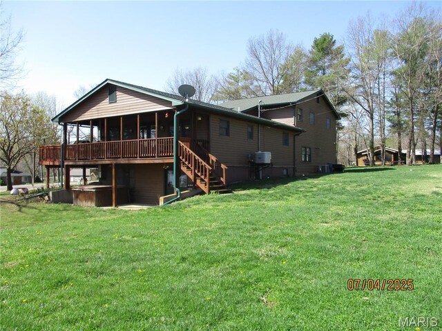 1653 Lakeshore Dr, Cuba, MO 65453 - back of house featuring stairs, a lawn, and a wooden deck