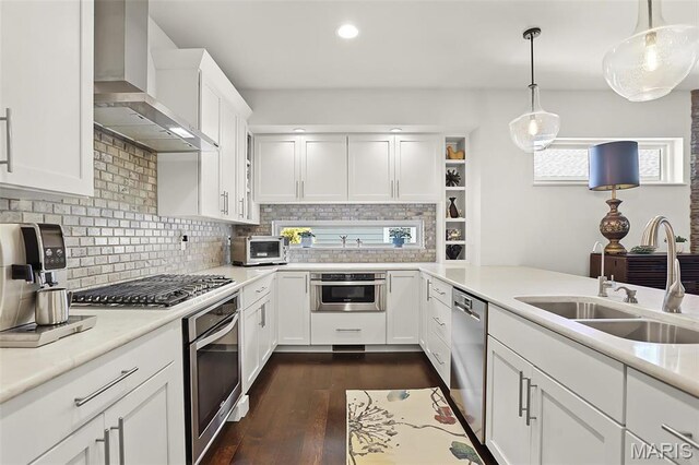 1420 Randle St, Edwardsville, IL 62025 - kitchen with wall chimney exhaust hood, appliances with stainless steel finishes, a sink, dark wood-style flooring, and tasteful backsplash