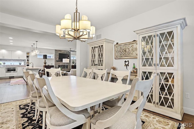 1420 Randle St, Edwardsville, IL 62025 - dining space with a chandelier, wood finished floors, and recessed lighting
