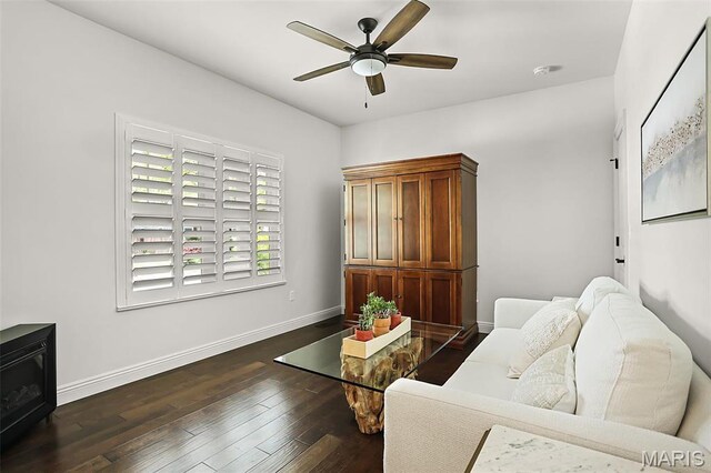 1420 Randle St, Edwardsville, IL 62025 - living area with ceiling fan, dark wood-style flooring, and baseboards