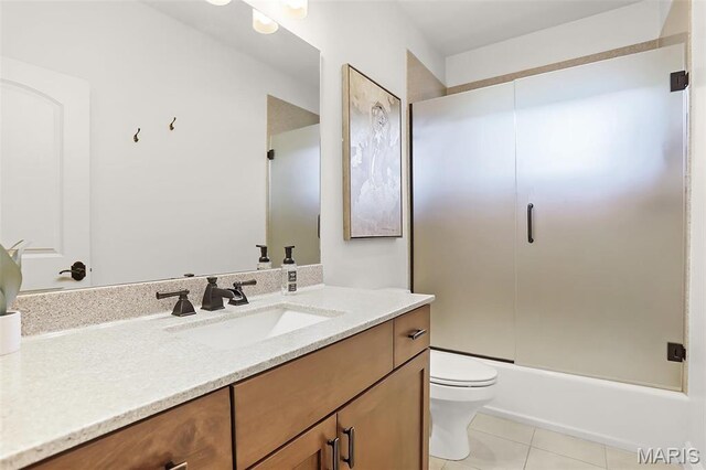1420 Randle St, Edwardsville, IL 62025 - bathroom featuring vanity, toilet, enclosed tub / shower combo, and tile patterned flooring