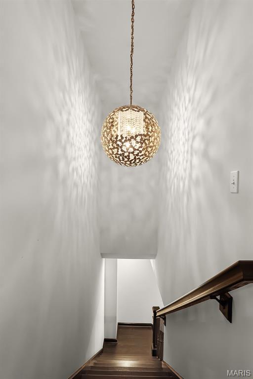 1420 Randle St, Edwardsville, IL 62025 - stairway featuring a chandelier and wood finished floors