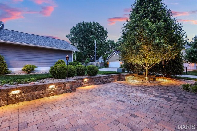 1420 Randle St, Edwardsville, IL 62025 - patio terrace at dusk featuring a patio and an outbuilding