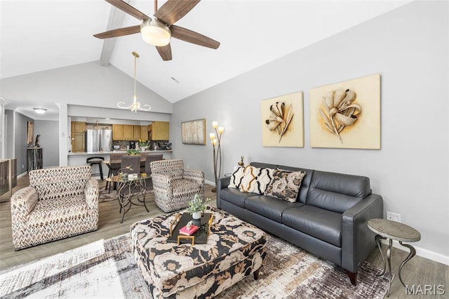living area with wood finished floors, baseboards, and ceiling fan