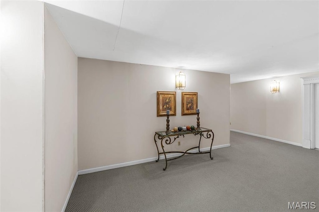 basement with carpet flooring and baseboards